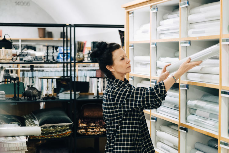 WOMAN WORKING AT OFFICE