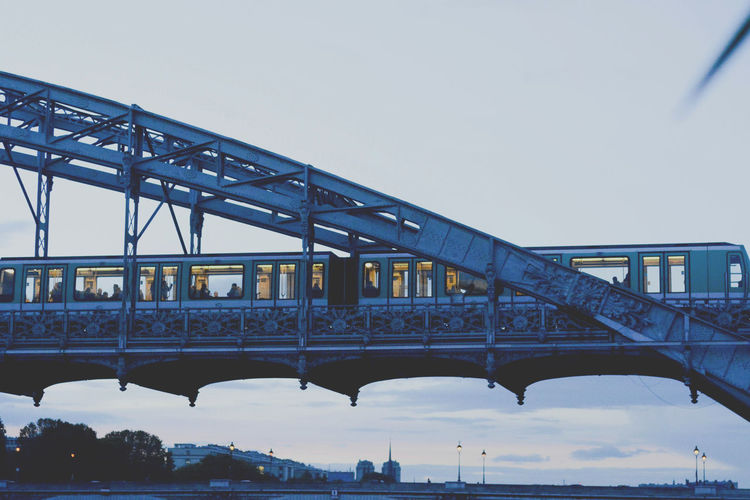 Bridge over seine river against sky in city