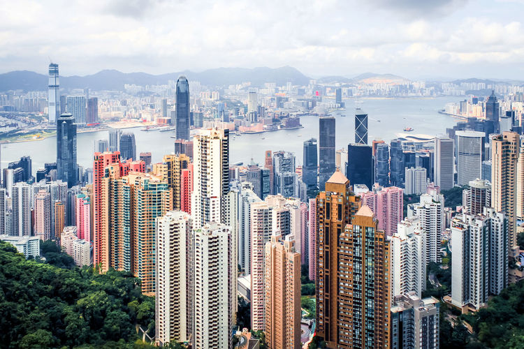 Aerial view of modern buildings in city against sky