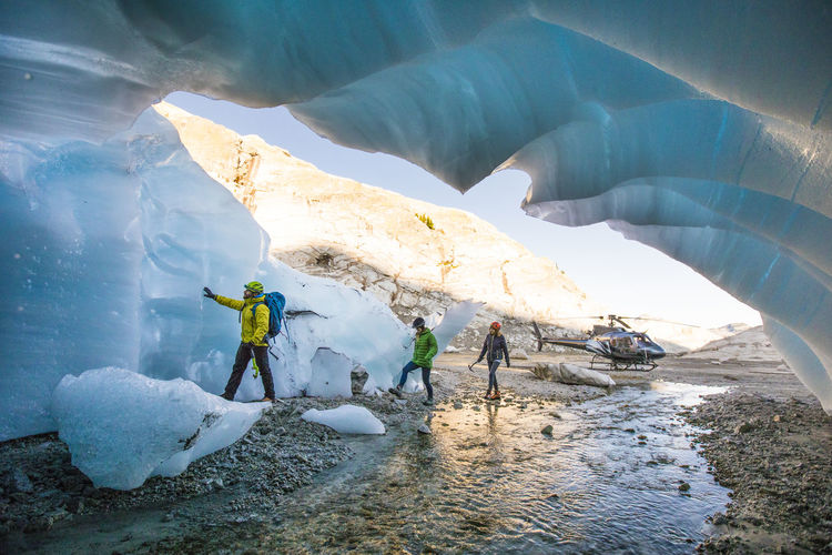 Explorers enter a glacial cave near vancouver, b.c.