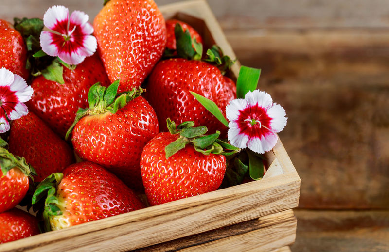 Close-up of strawberries in basket on table