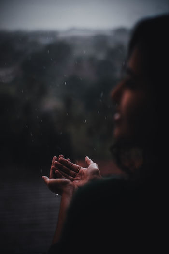 Woman playing in rain water