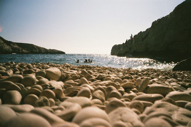 Surface level of pebble beach against sky, juillet 2015 marseille france