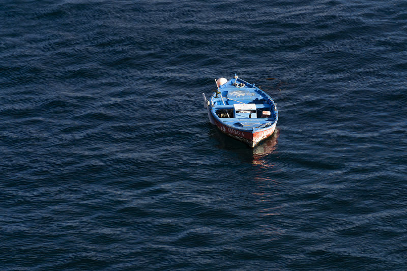 High angle view of boat sailing in sea