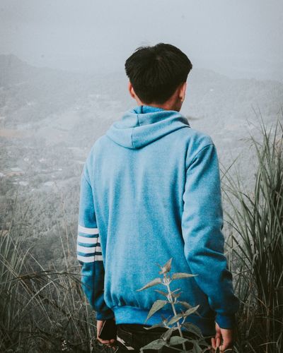 Rear view of boy looking at mountain