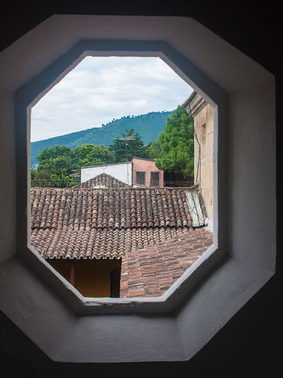 Houses seen through window of building