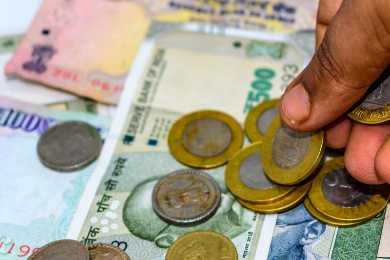 Cropped hand counting currency