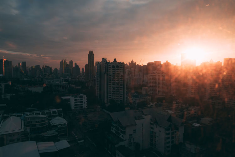 Cityscape against sky during sunset