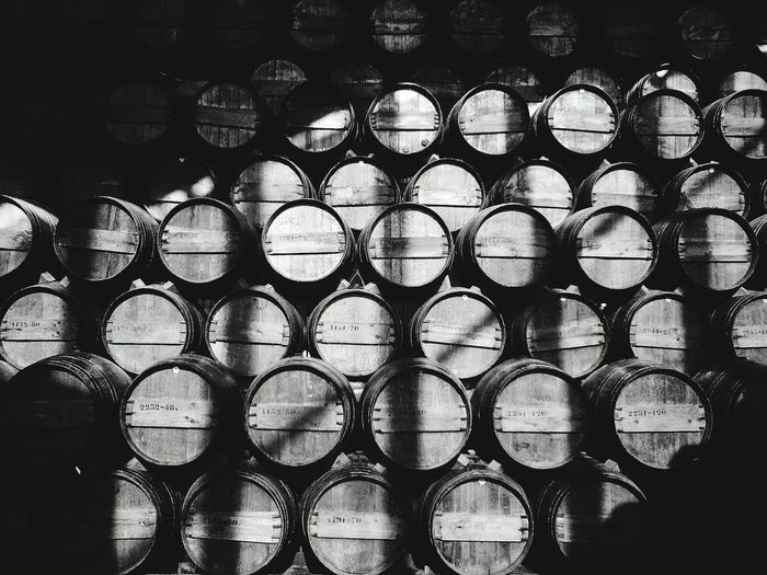 Full frame shot of wine casks in cellar