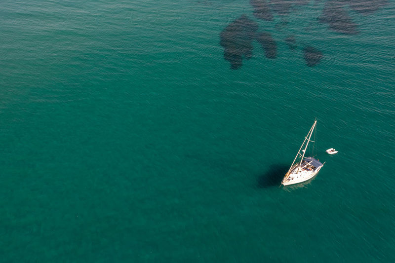 Aerial view of a luxury yacht anchored in the surface of the sea. cyprus vacations