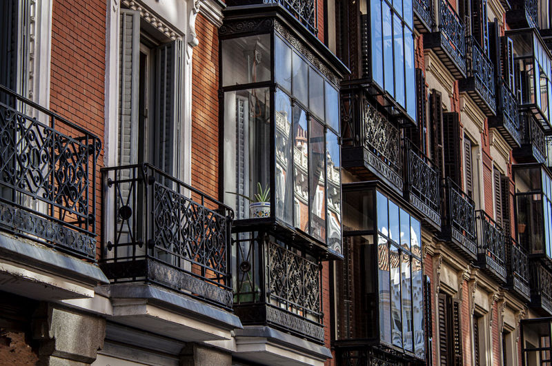 Facade of historical buildings in madrid, spain, europe. mediterranean street in retiro neighborhood