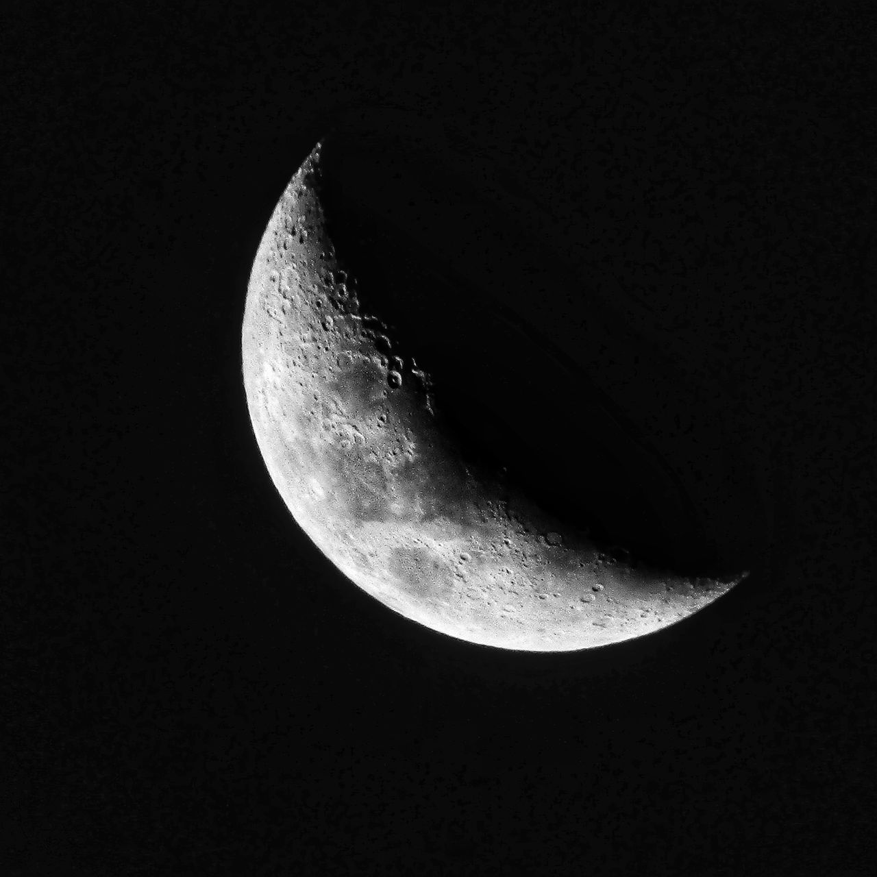 LOW ANGLE VIEW OF HALF MOON IN SKY AT NIGHT