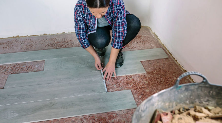 Female tile worker working at home
