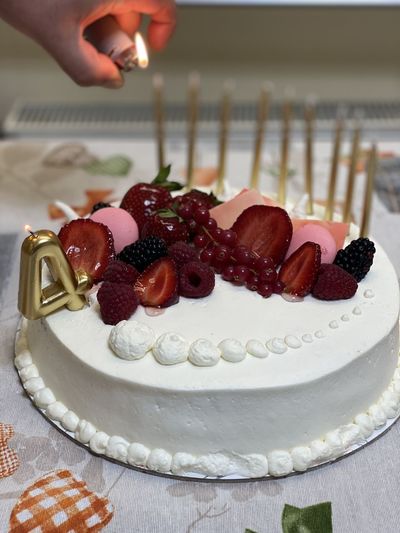Close-up of hand holding cake