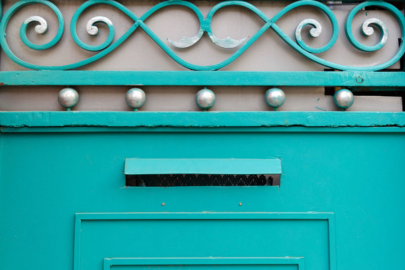 Detail of iron gates with decorative elements different shapes, close-up.