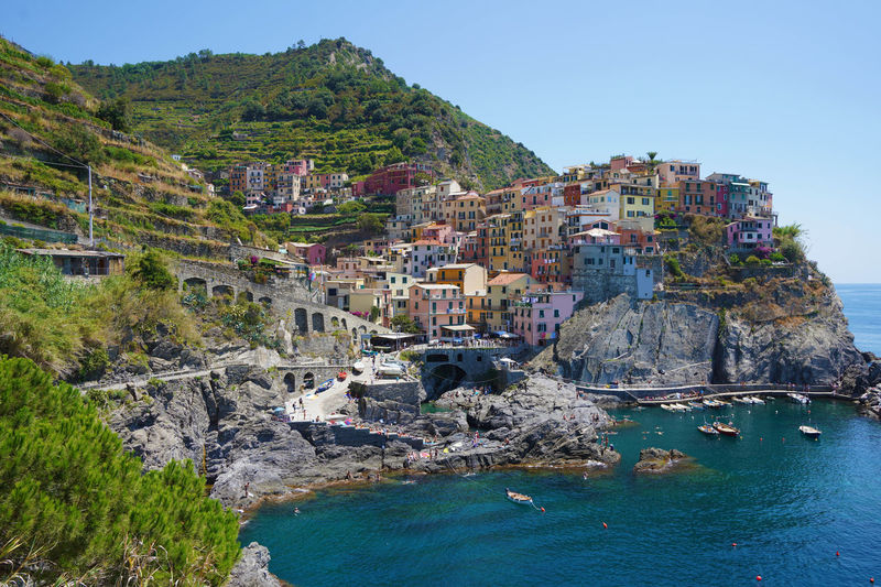 Manarola typical village in national park of cinque terre with colorful houses on rock cliff, italy