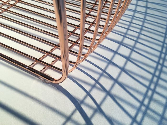High angle view of copper grate on white table