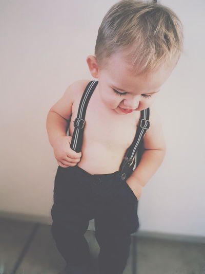 Portrait of baby wearing suspenders
