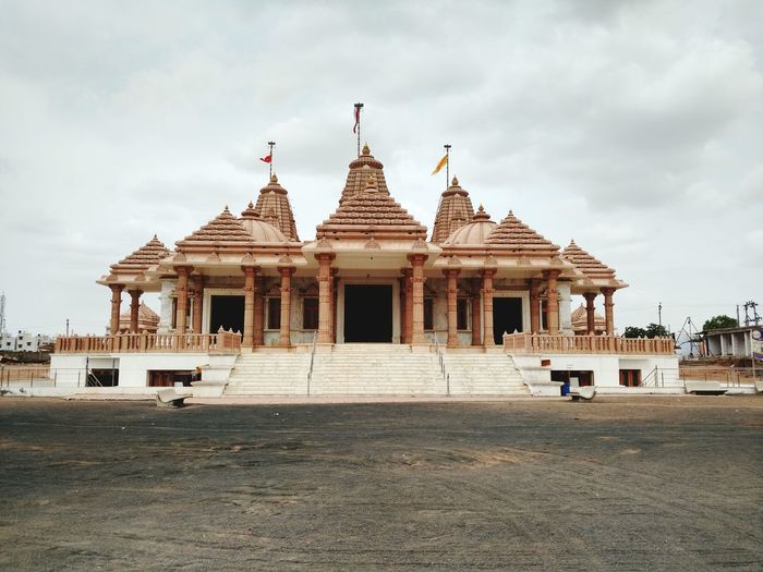 View of temple against cloudy sky