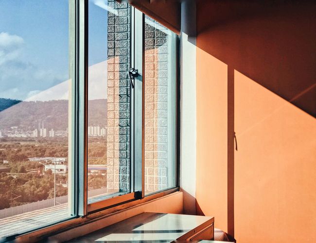 Office Window Interior Office Interior Orange Wall Window EyeEm Selects Window Architecture Built Structure No People Day Glass - Material Transparent Sunlight Indoors Reflection Open Nature Mountain Sky Architecture Reflection Modern Indoors