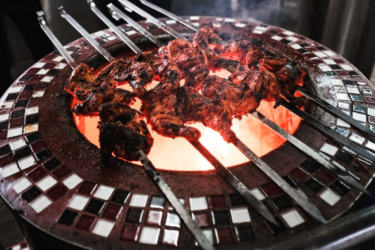 Close up view of chicken tandoori on barbecue grill