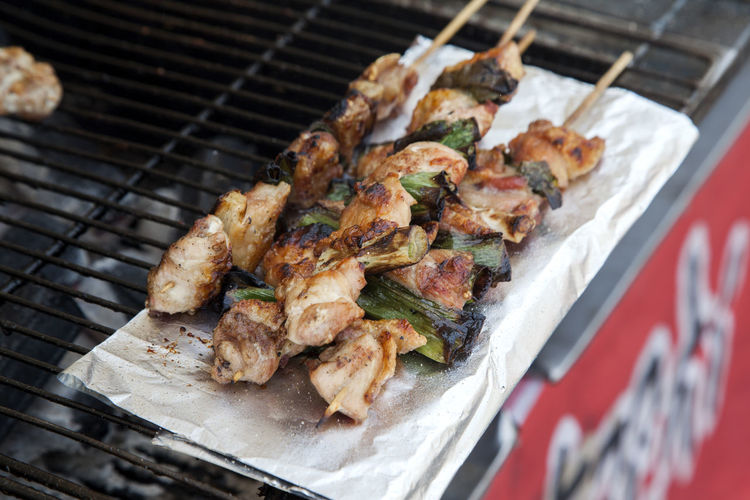 Close-up of chicken skewers on barbecue grill