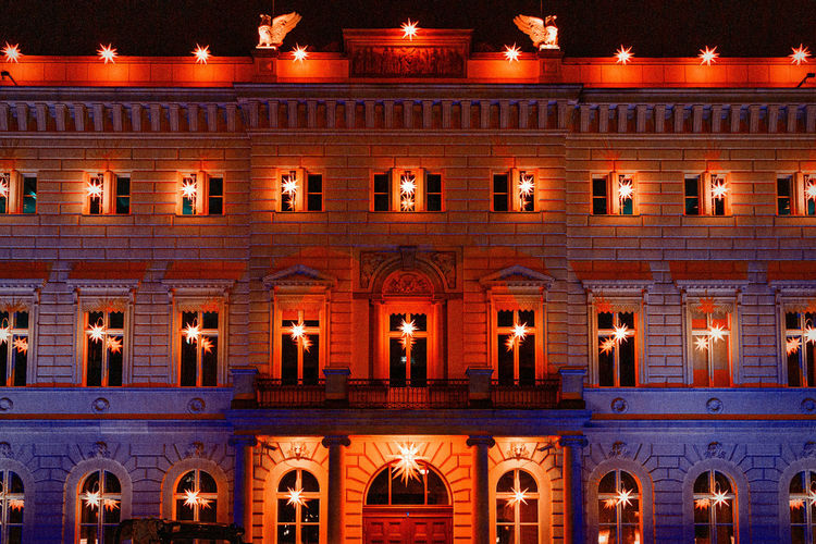 Facade of illuminated building at night
