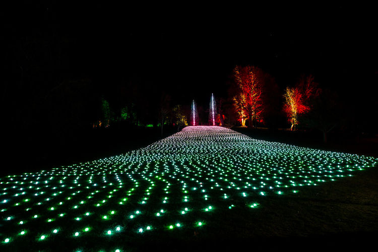 Illuminated lights in park at night