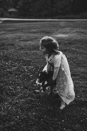 Full length of girl standing on field