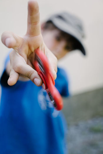 Close-up of boy with fidget spinner toy