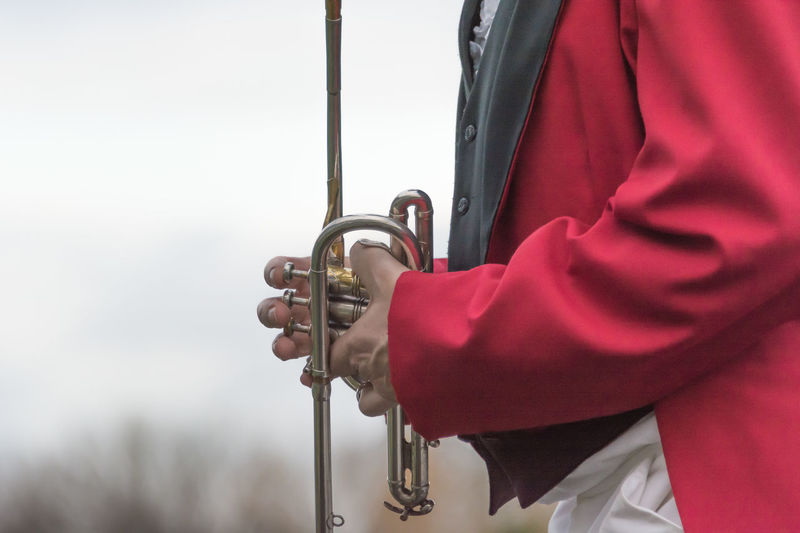 Close-up of man holding hands holding trumpet