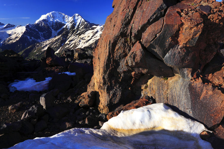 View of snowcapped mountains against blue sky