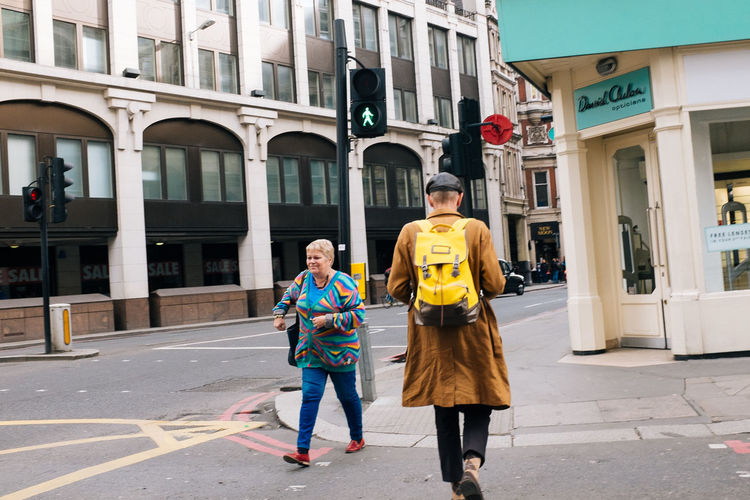 Woman standing on city street