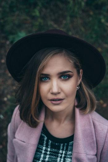 Portrait of beautiful young woman with hat